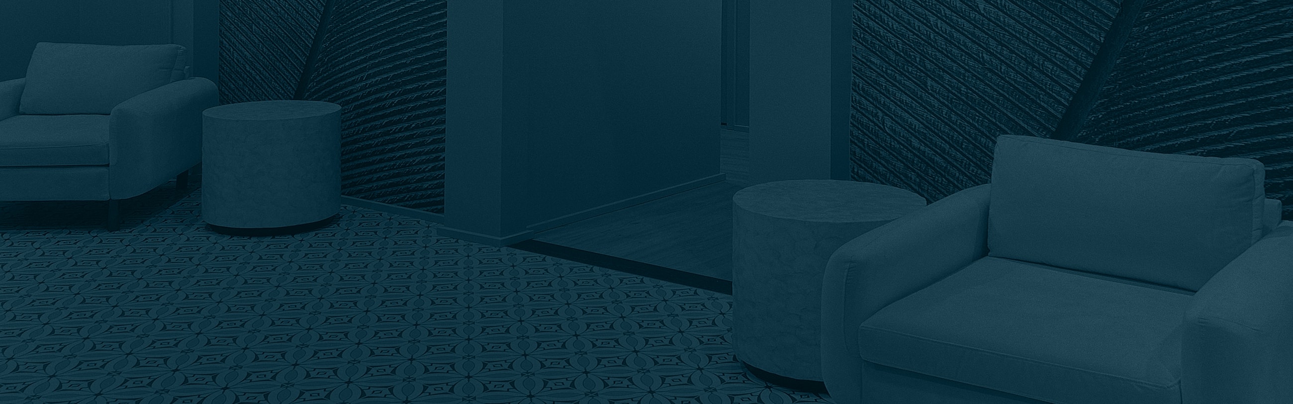 Modern lounge area with sofa and side tables.