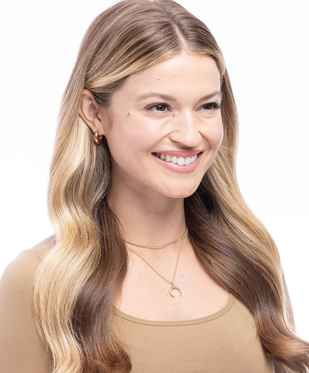 Close-up of face with soft features and makeup.