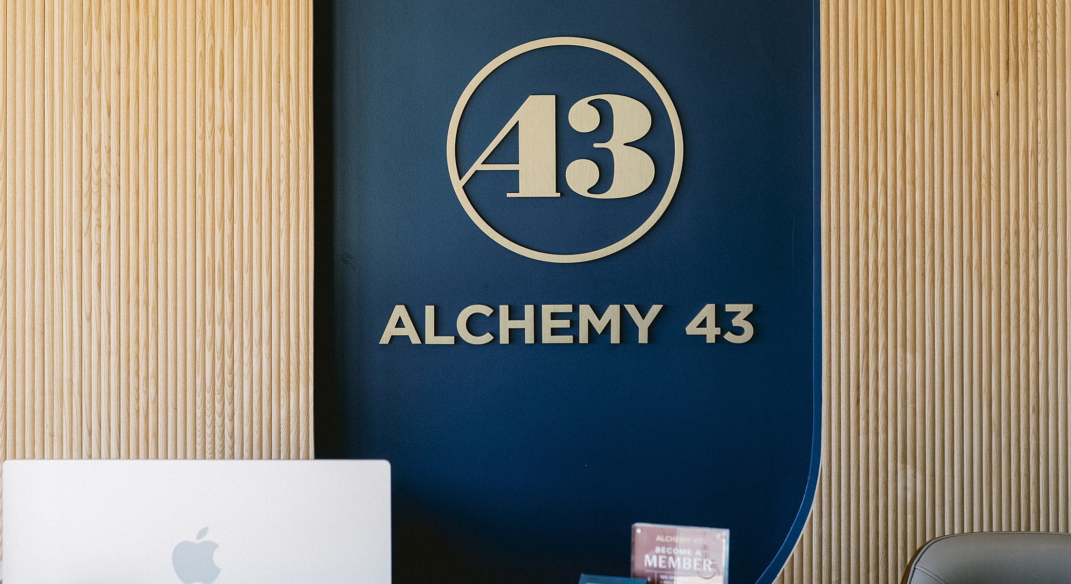 Logo and branding of Alchemy 43 office.