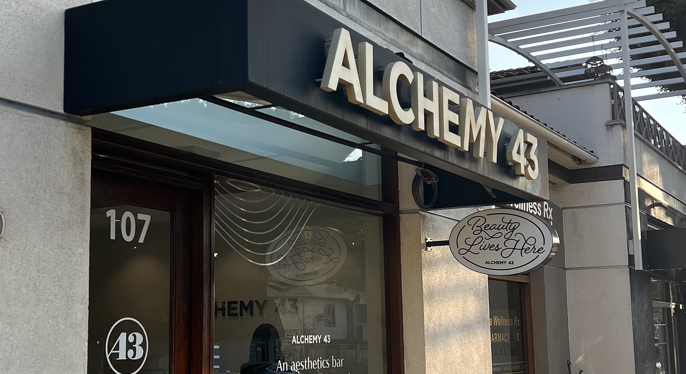 Signage for Alchemy 43 aesthetics bar.