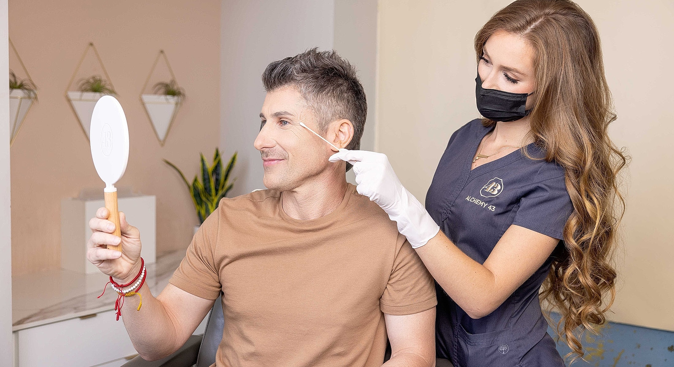 Woman examining her reflection in a mirror.